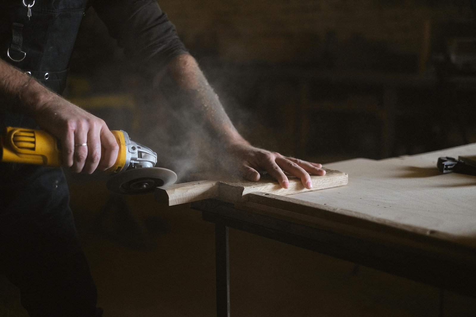 Professional joiner working on cabinetry or woodwork installation