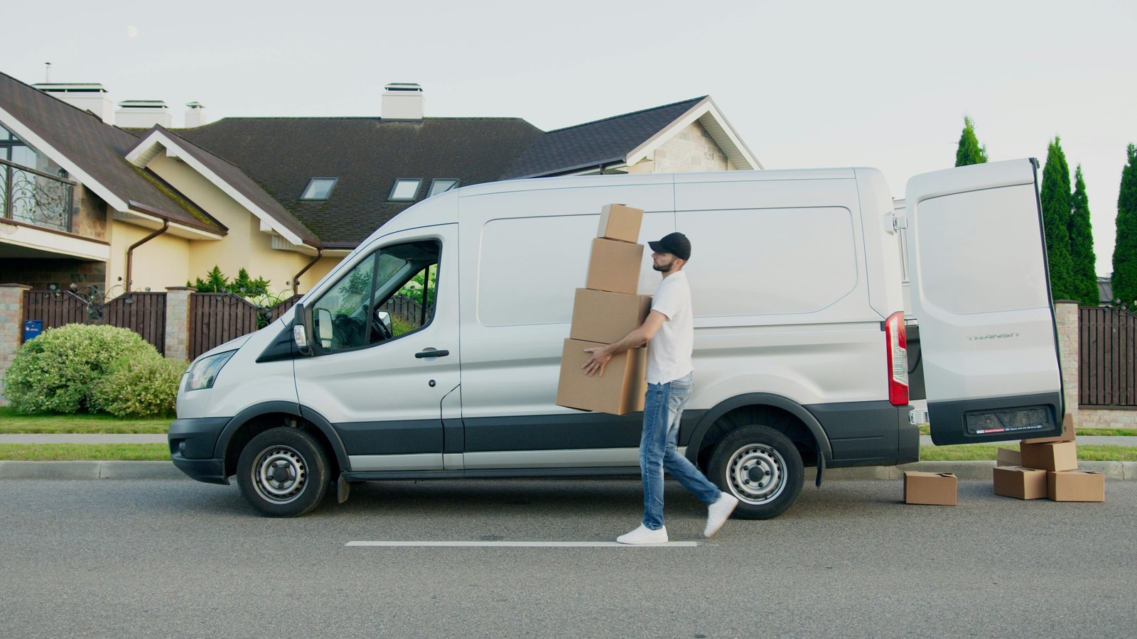 Man with van unloading furniture